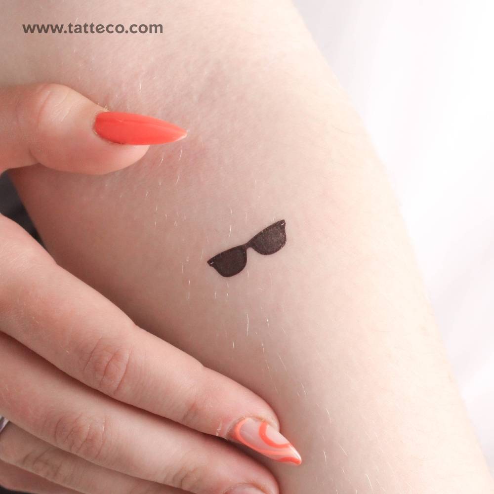 Sunglasses temporary tattoo located on the inner forearm.