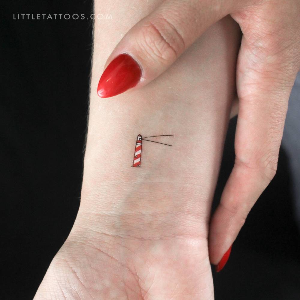 Color lighthouse temporary tattoo placed on the wrist.