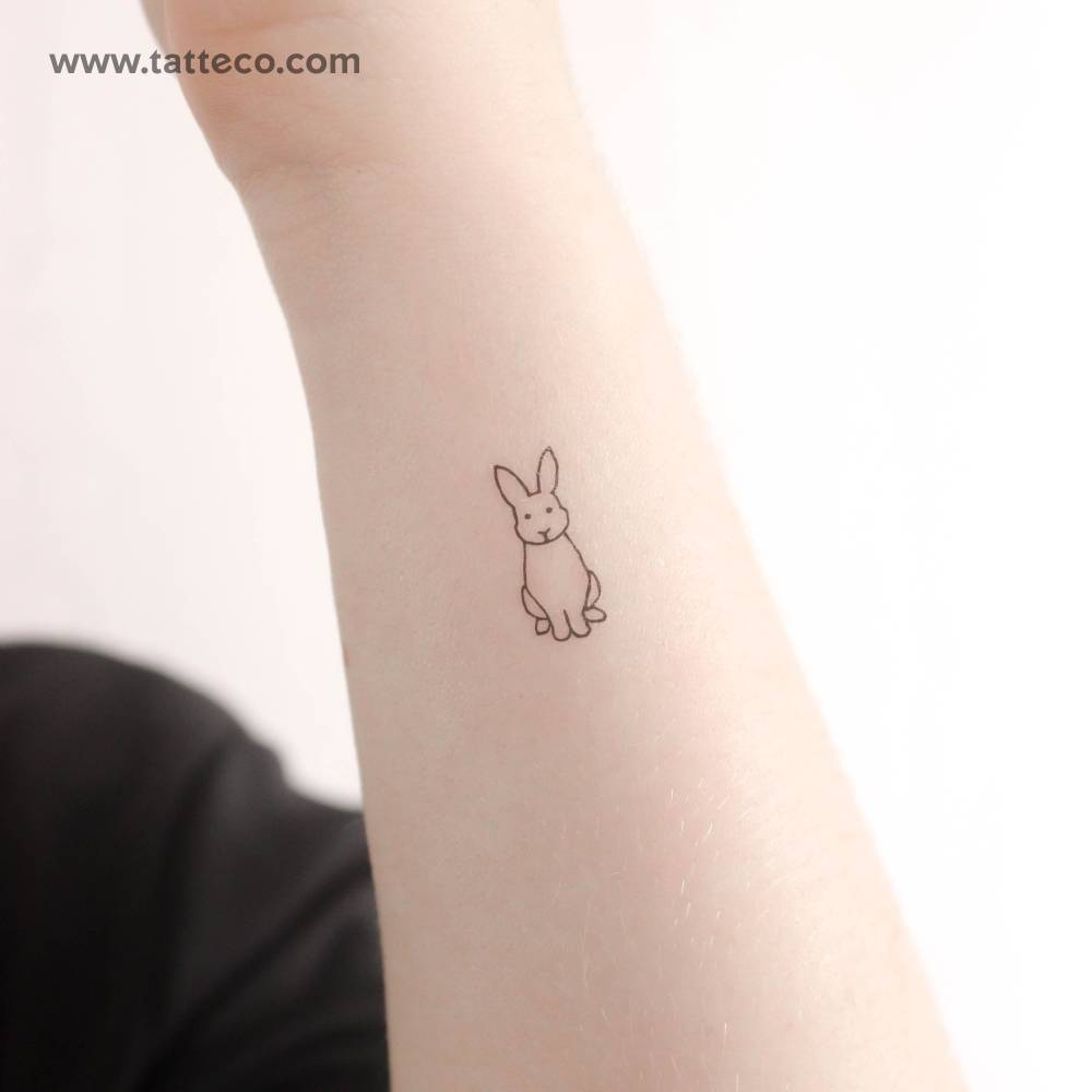 Sitting rabbit temporary tattoo located on the wrist.