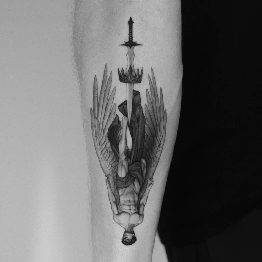Icarus and sword tattoo located on the forearm, micro-realistic style.