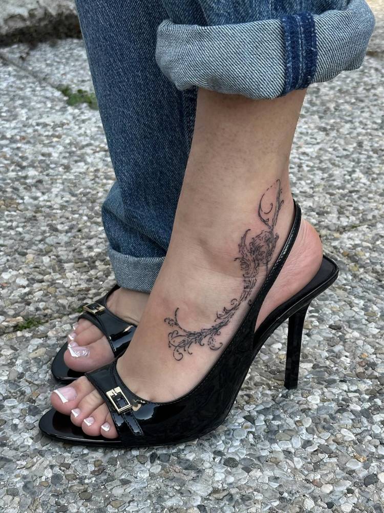 Ornamental design tattooed on the ankle and foot.