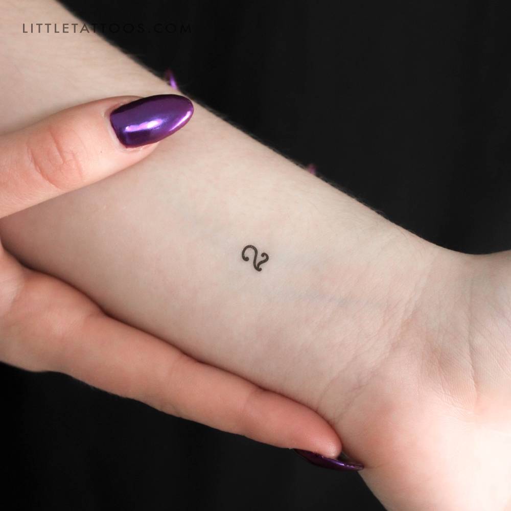 Minimalistic number "2" temporary tattoo in typewriter font.