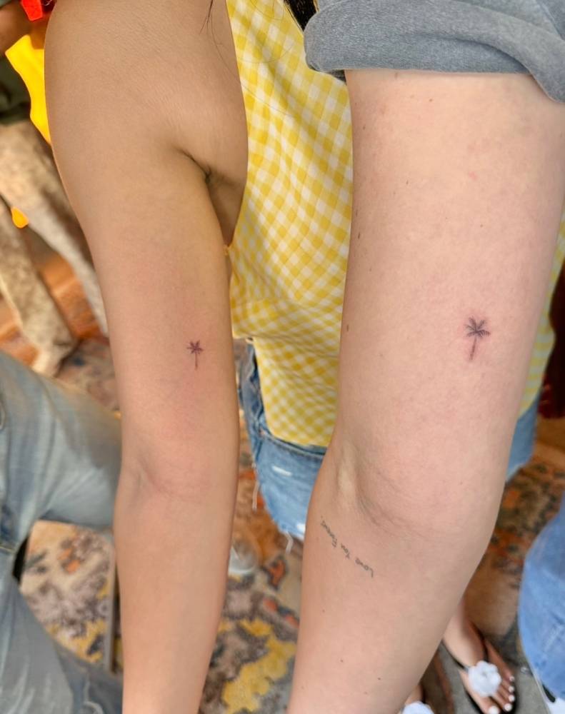 Matching single needle palm tree tattoo for best friends.
