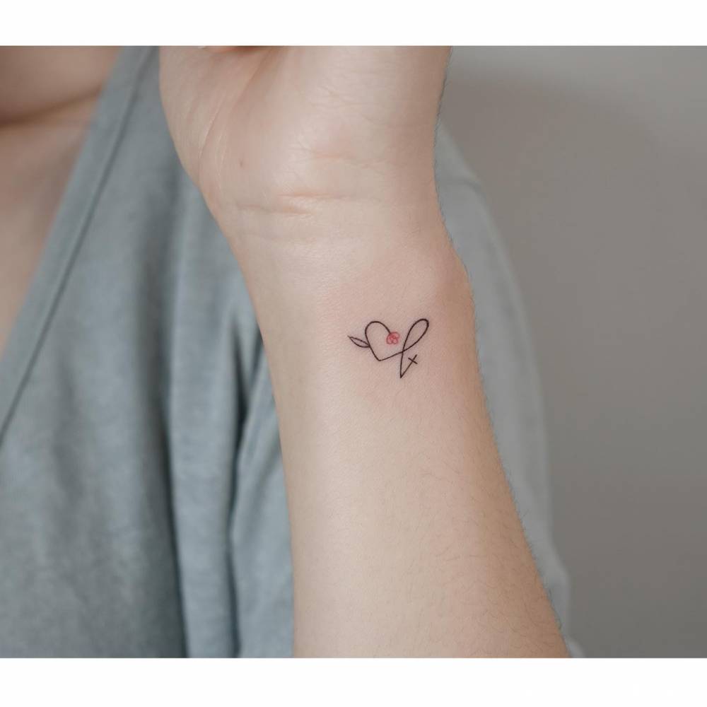 Jesus fish, flower heart and cross tattoo in minimalistic style.