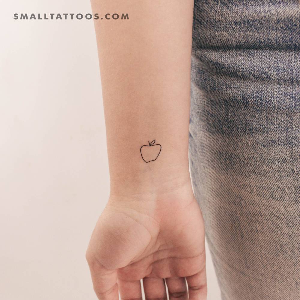 Minimalist apple temporary tattoo placed on the wrist.