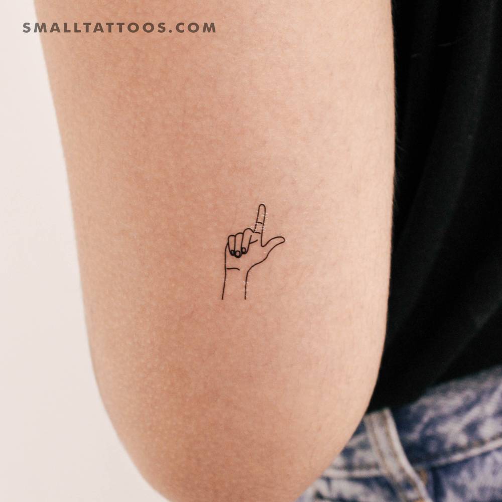 Sign language letter "L" temporary tattoo located on the tricep.