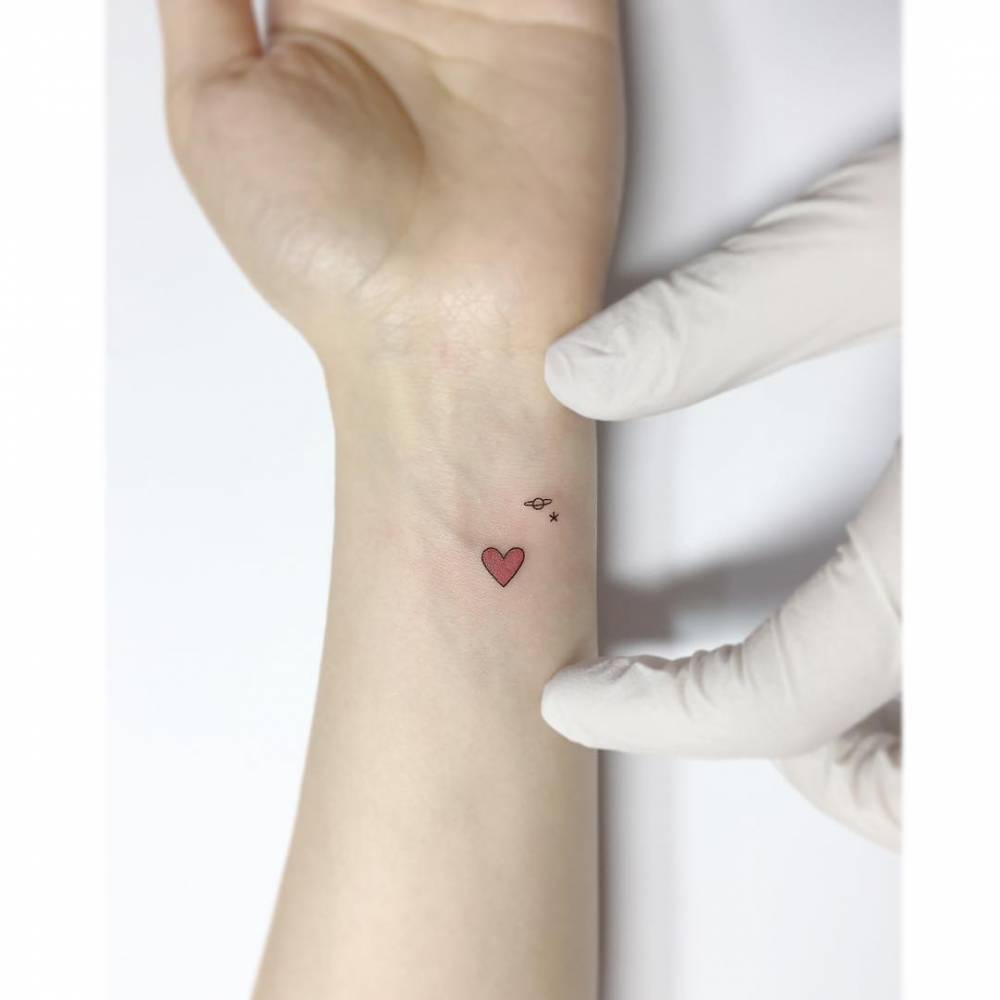 Minimalistic style heart, Saturn and star tattoo in minimalistic style.