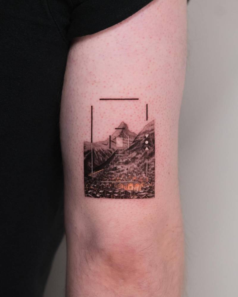 Micro-realistic style Matterhorn tattoo located on the tricep.
