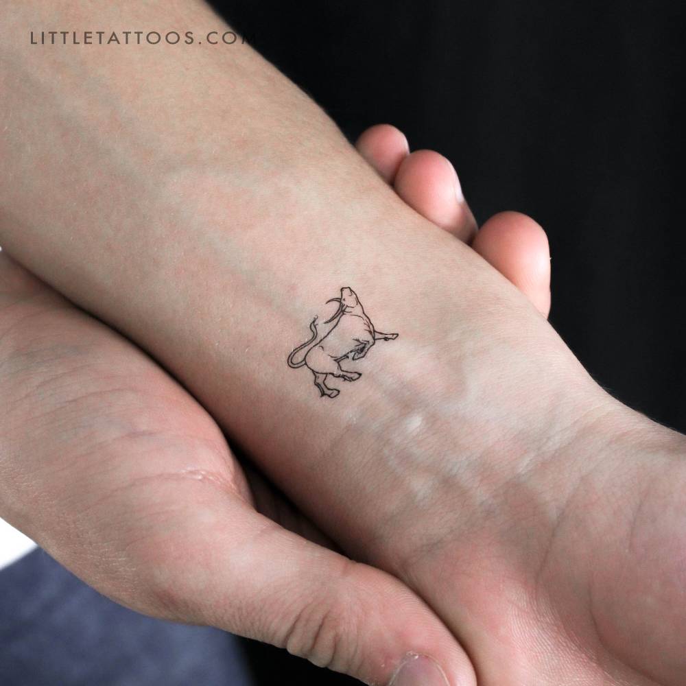 Bull temporary tattoo located on the wrist.