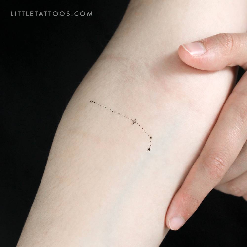 Minimalistic style Aries constellation temporary tattoo located on the inner forearm.