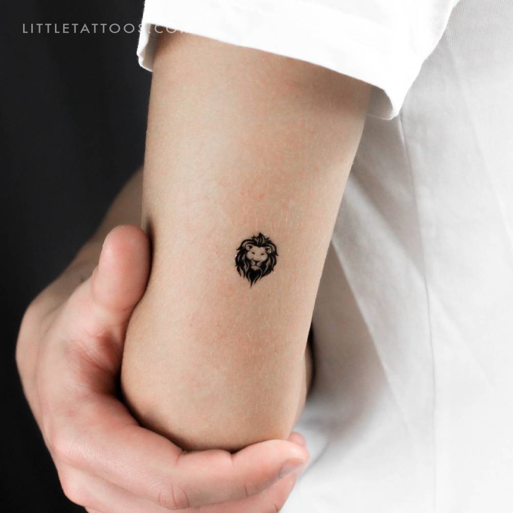 Lion face temporary tattoo located on the tricep.