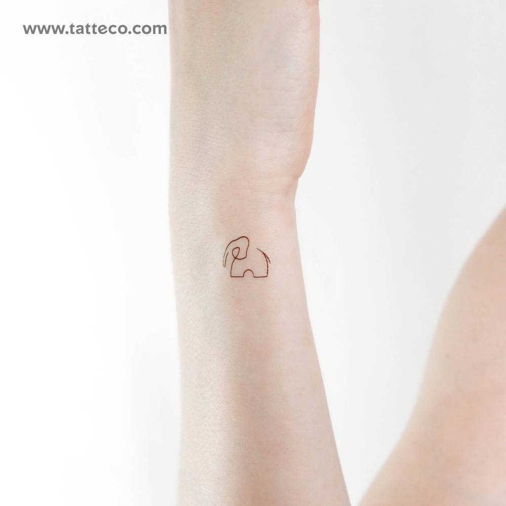 Single line elephant temporary tattoo placed on the wrist.