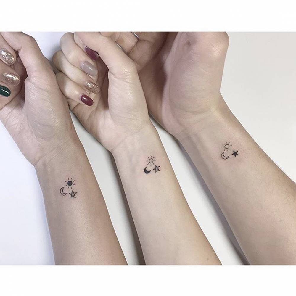 Matching sun, moon and star tattoo for best friends.