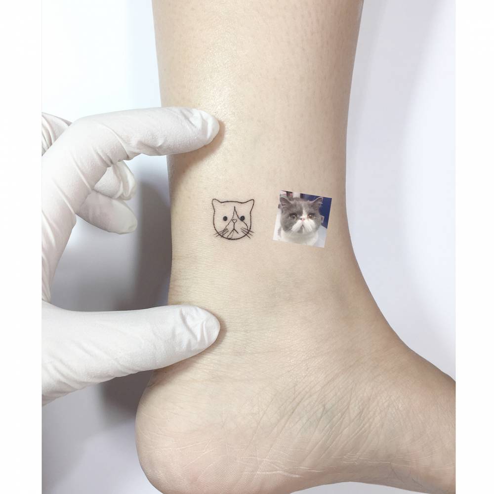 British Shorthair cat portrait tattooed on the ankle.
