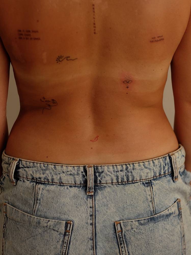 Back composition tattoos in minimalistic style.