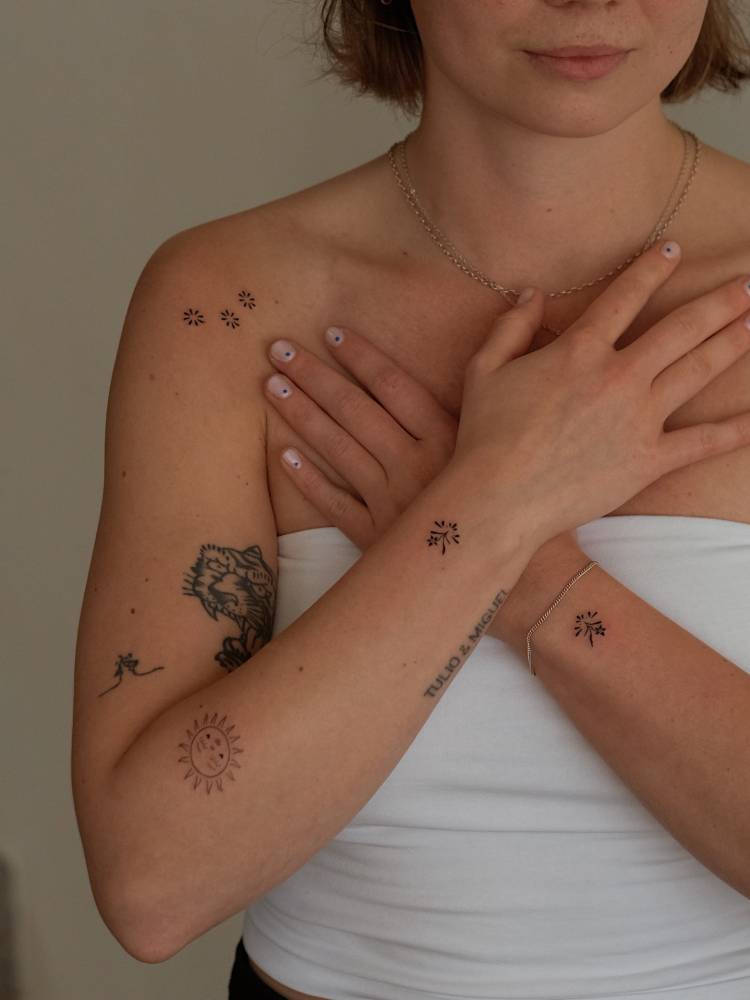 Matching ornaments tattooed on the wrists.