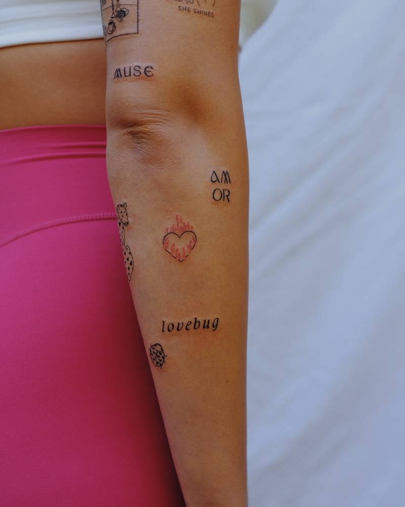 Forearm composition tattoos.