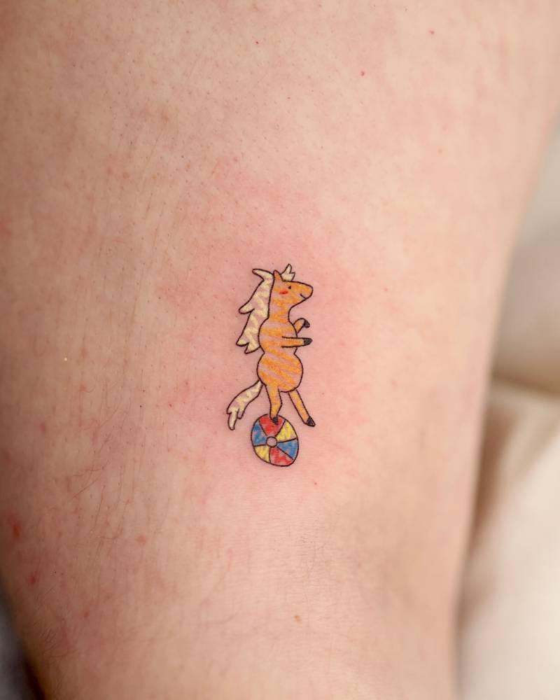 James Baxter from adventure time tattooed on the upper arm.