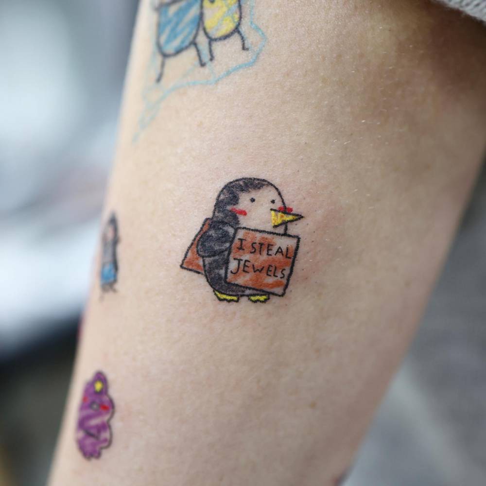 Gunter from Adventure Time tattooed on the inner forearm.