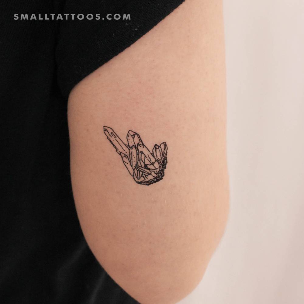 Crystals temporary tattoo located on the tricep.