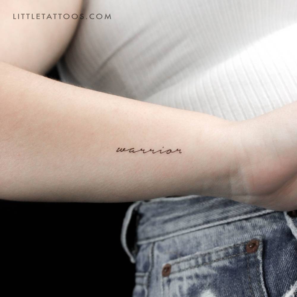 Handwritten font word "warrior" temporary tattoo located on the wrist.