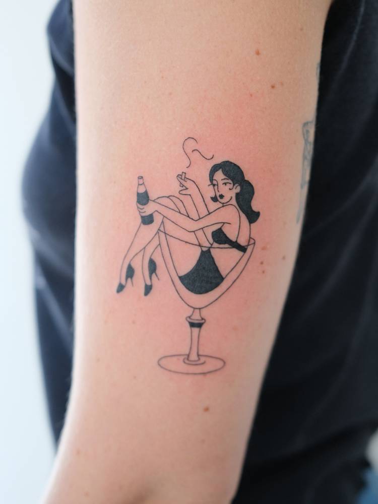 Smoking lady tattooed on the upper arm, illustrative style.