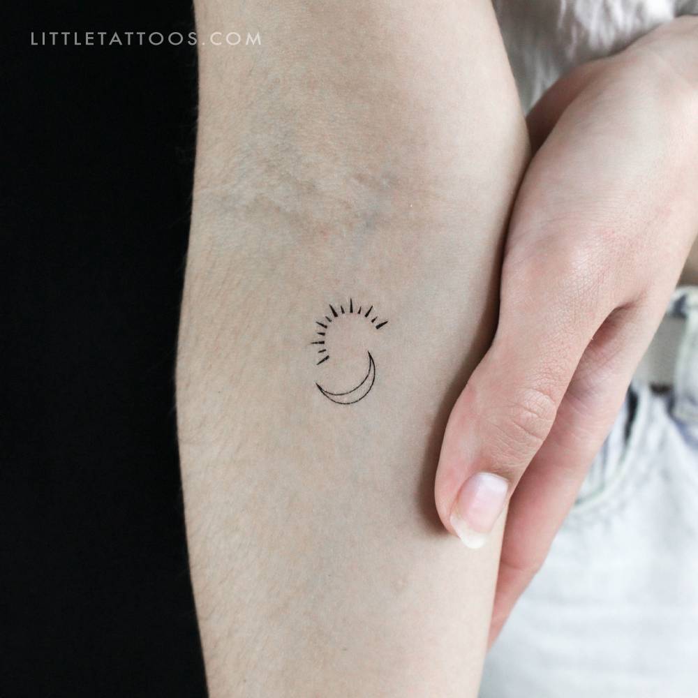 Minimalist sun and moon temporary tattoo.