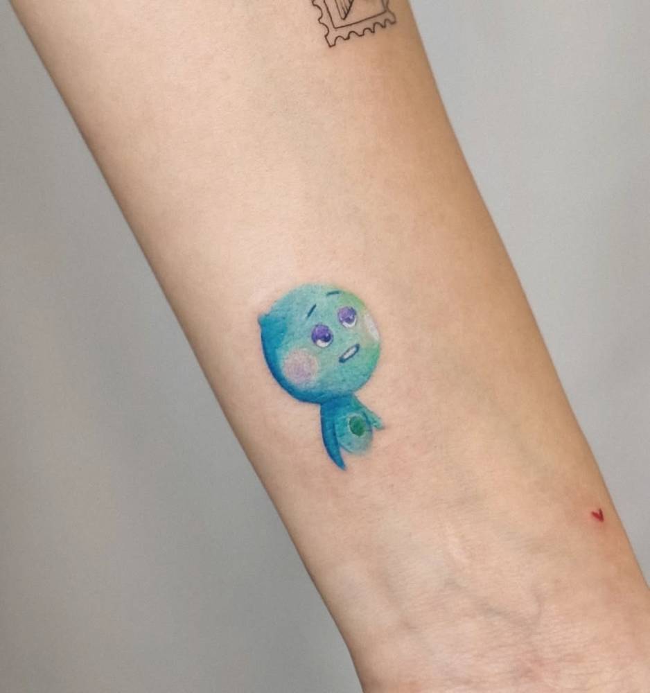 22 from 'Soul' tattoo located on the wrist, done in cartoon style.