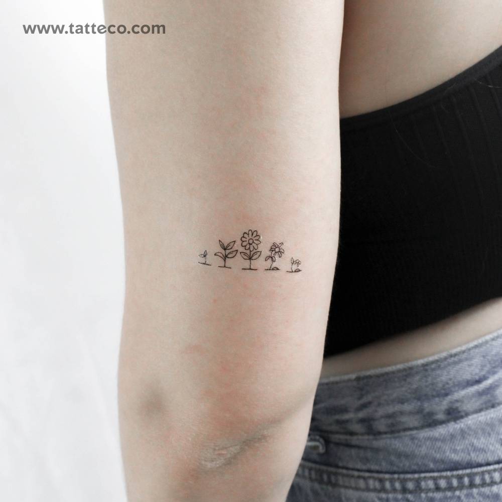 Life of a flower temporary tattoo placed on the tricep.
