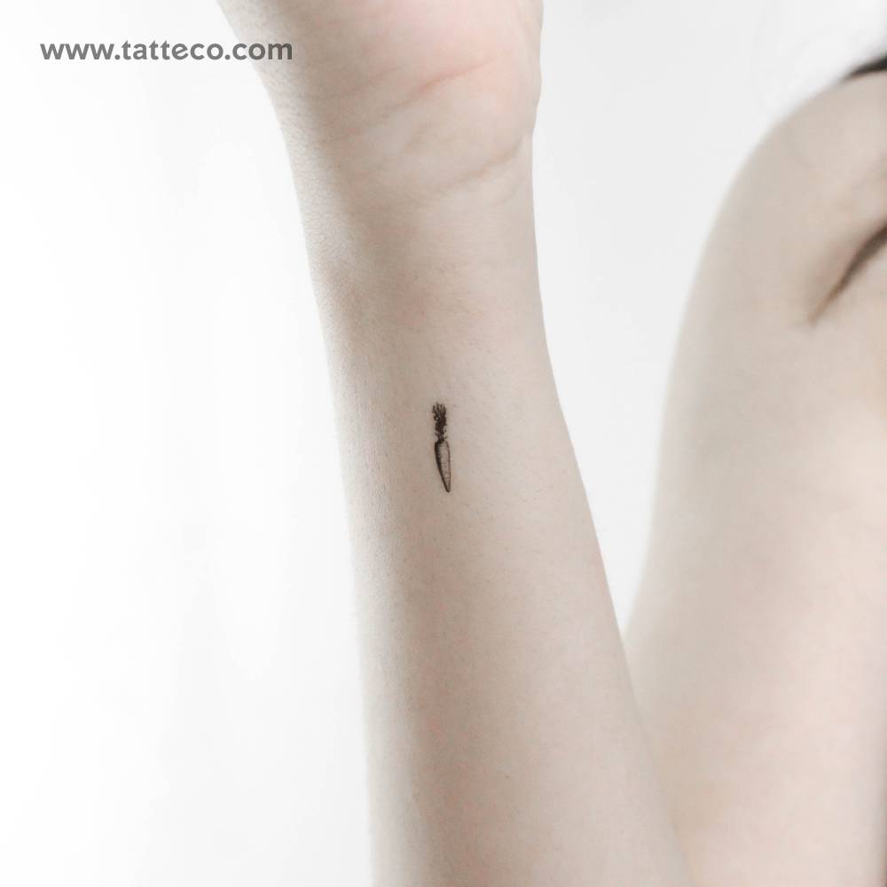 Tiny carrot temporary tattoo located on the wrist.
