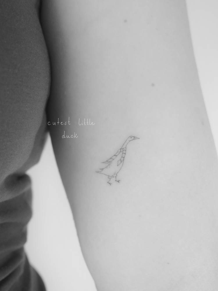 Fine line style duck tattoo located on the inner arm.