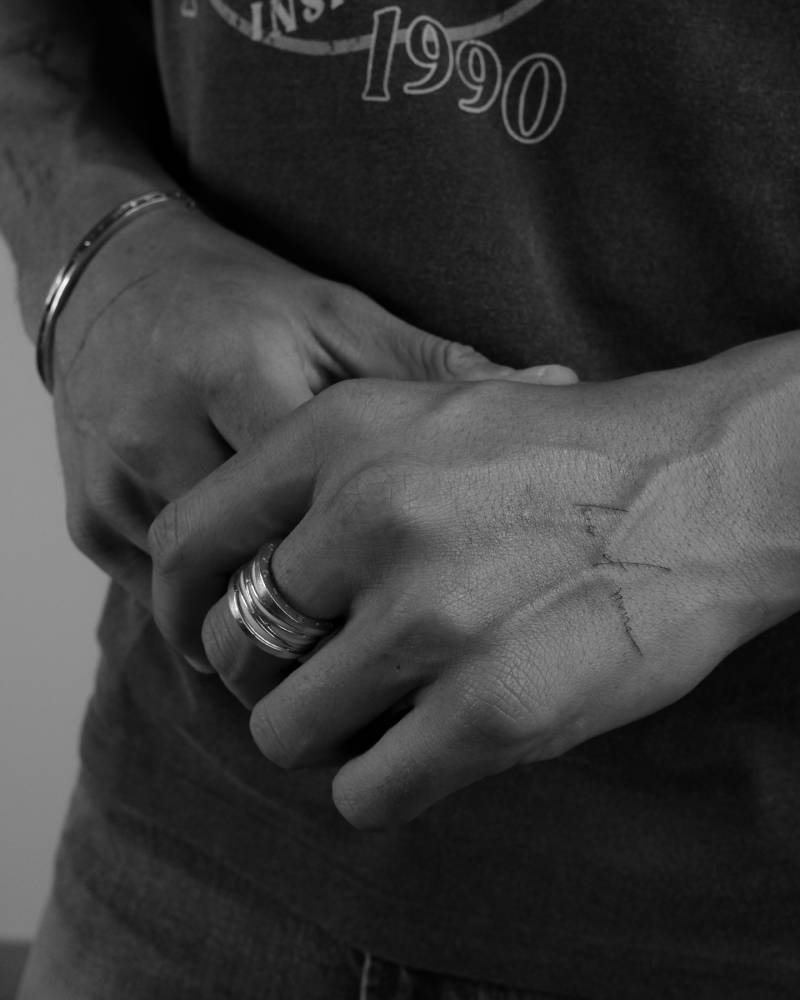 Handwritten font lettering tattoo located on Alejandro Speitzer's hand.