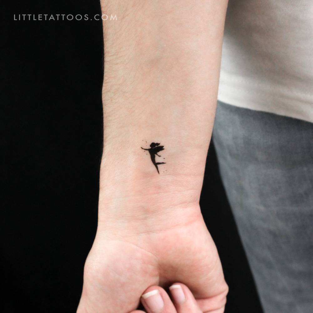 Little Tinker Bell silhouette temporary tattoo located on the wrist.