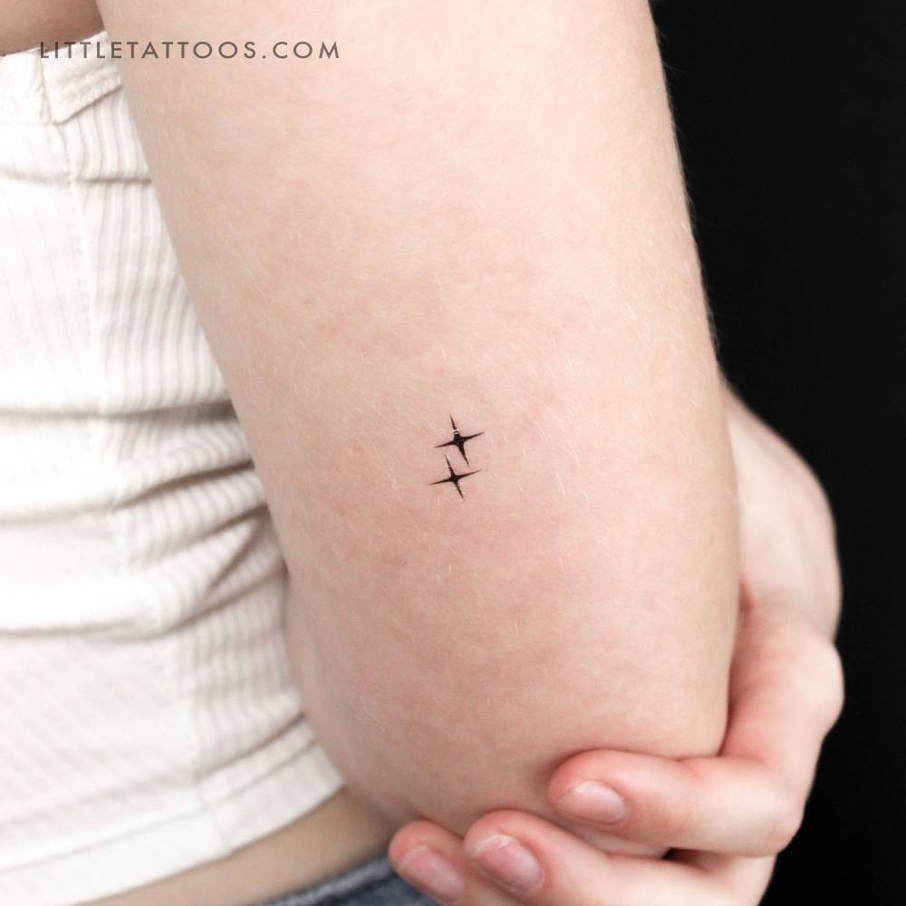 Sparkle couple temporary tattoo located on the tricep.