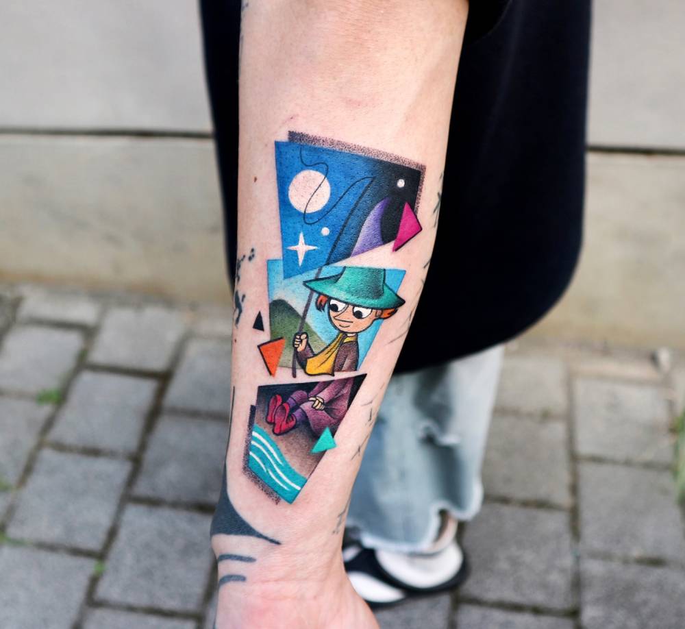 Collage style Snufkin tattoo located on the forearm.