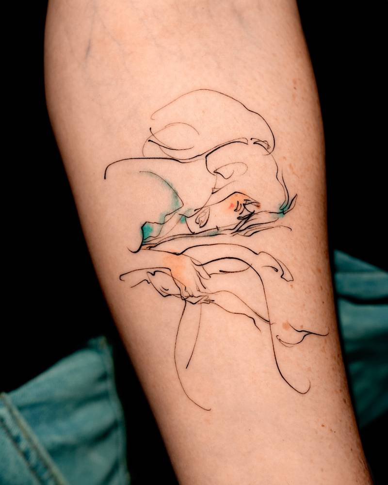 Chihiro and Haku tattoo in sketch work style placed on the inner forearm.
