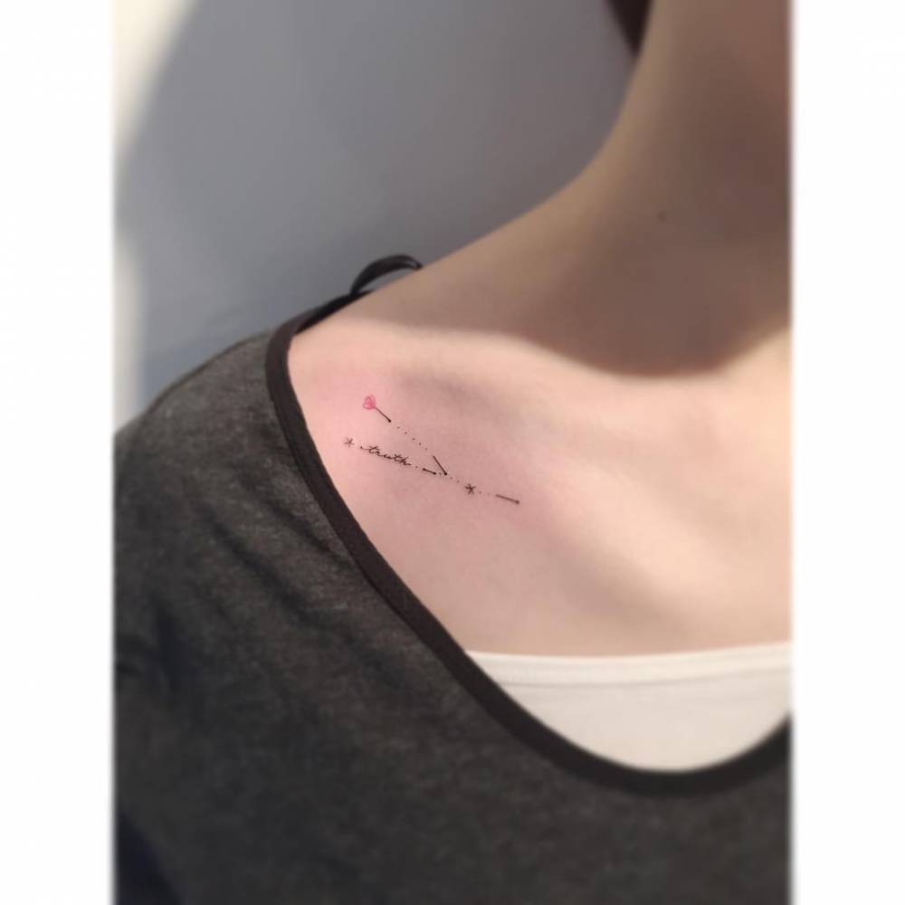 Taurus constellation tattoo located on the collarbone.