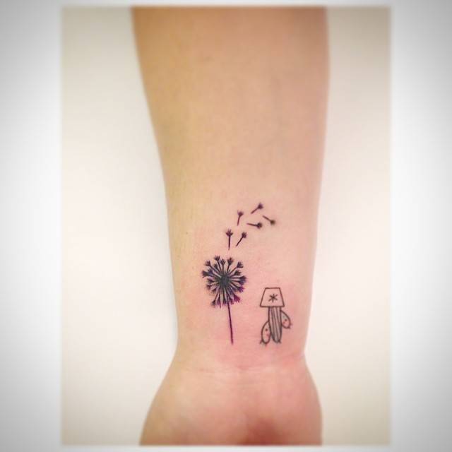 Dandelion and cactus tattoo located on the wrist, illustrative style.