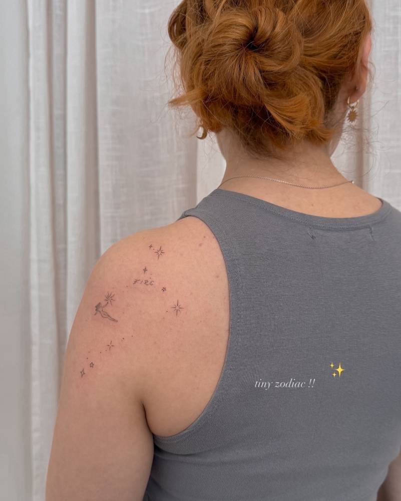 Leo constellation tattoo located on the shoulder blade.