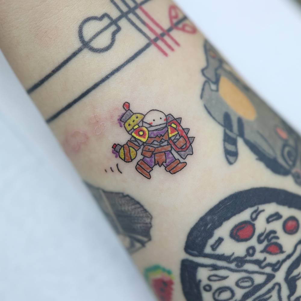Singed from League of Legends tattooed on the wrist.