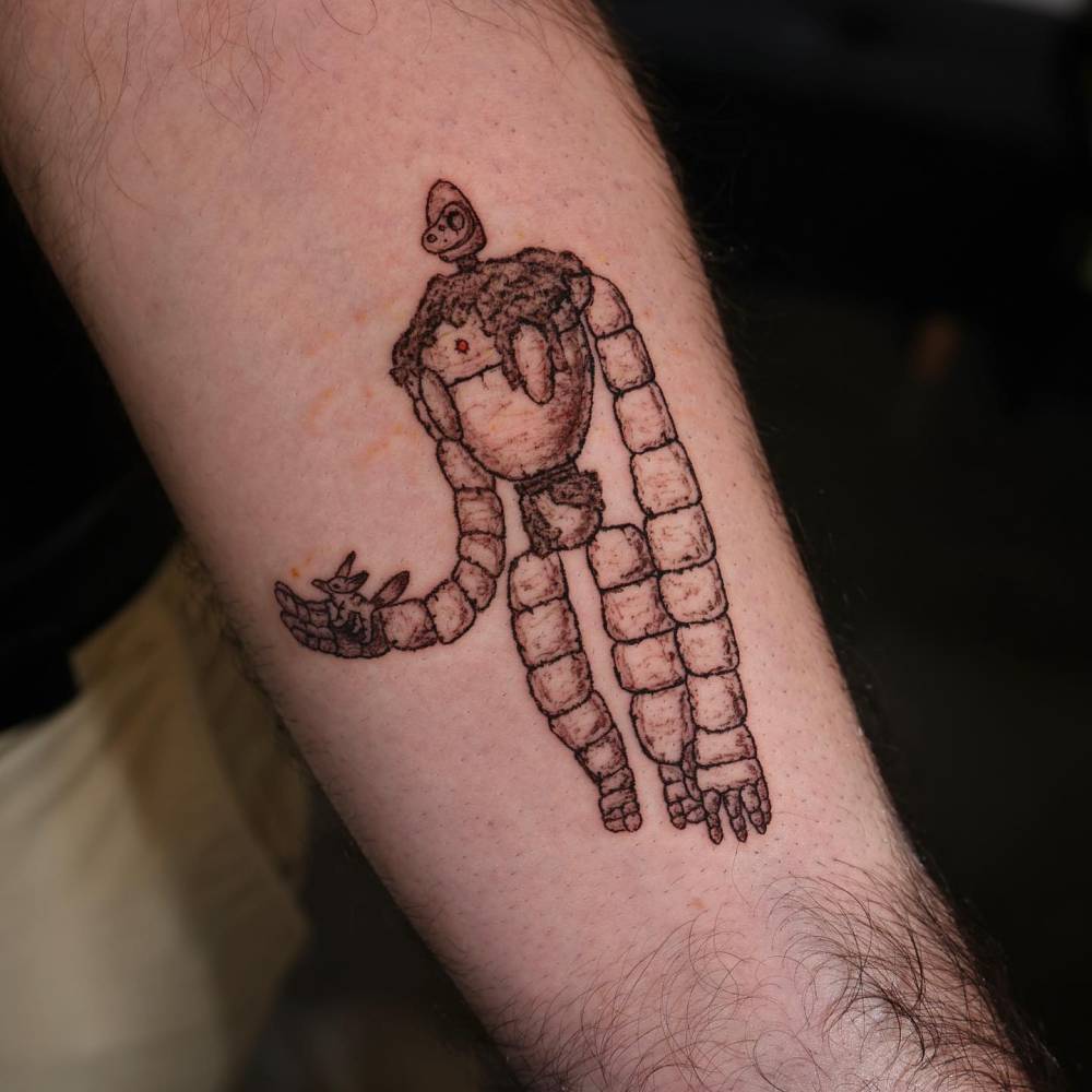 Robot from 'Castle in the Sky' tattooed on the inner forearm.