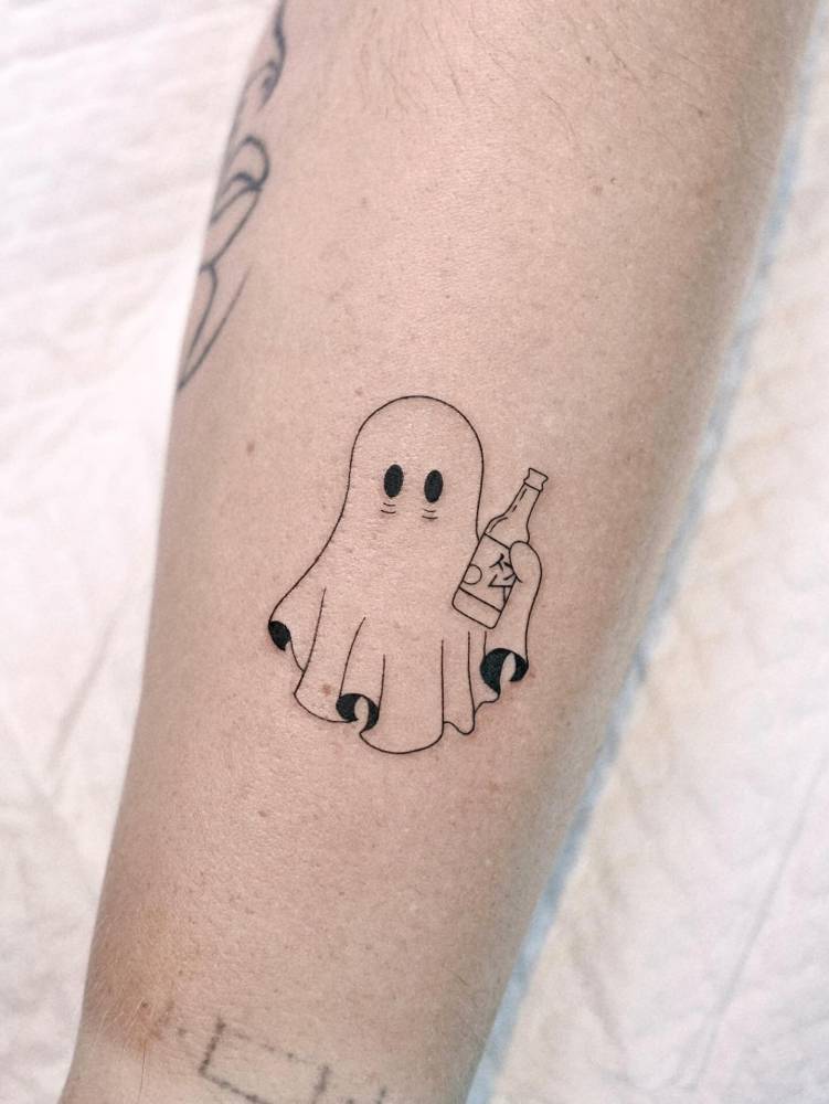 Ghost drinking soju tattooed on the forearm.