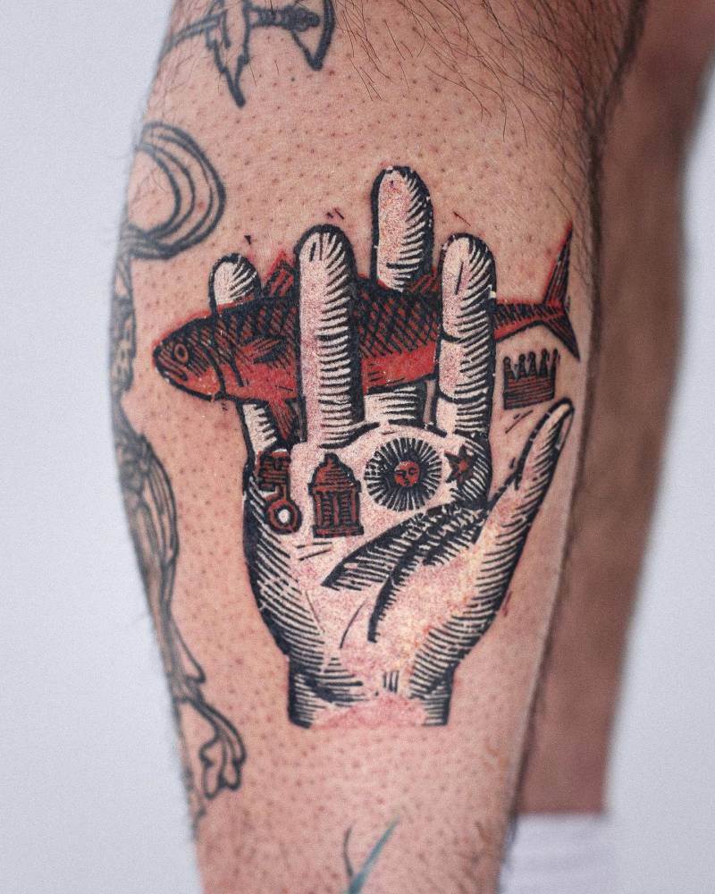 Philosopher's Hand tattoo located on the shin, pop art style.