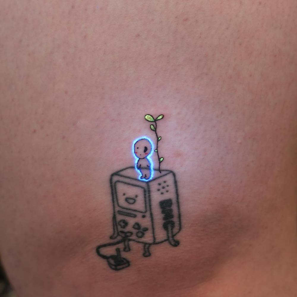 Fresh Kodama uv ink tattoo add on over existing tattoo.