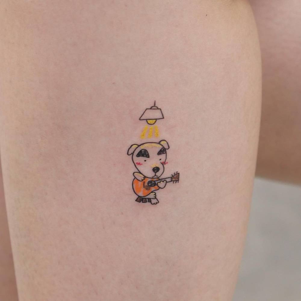 K.K. Slider from Animal Crossing tattooed on the calf.