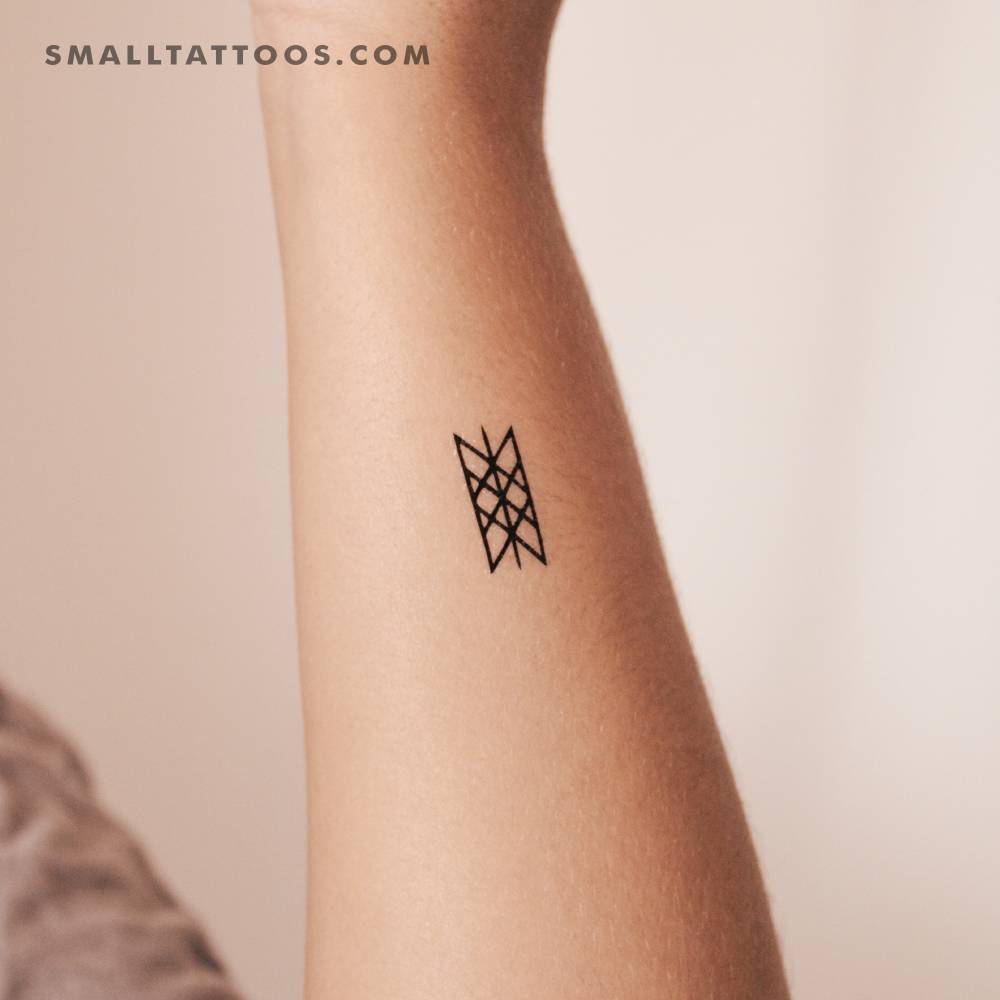 Web of Wyrd temporary tattoo located on the wrist.