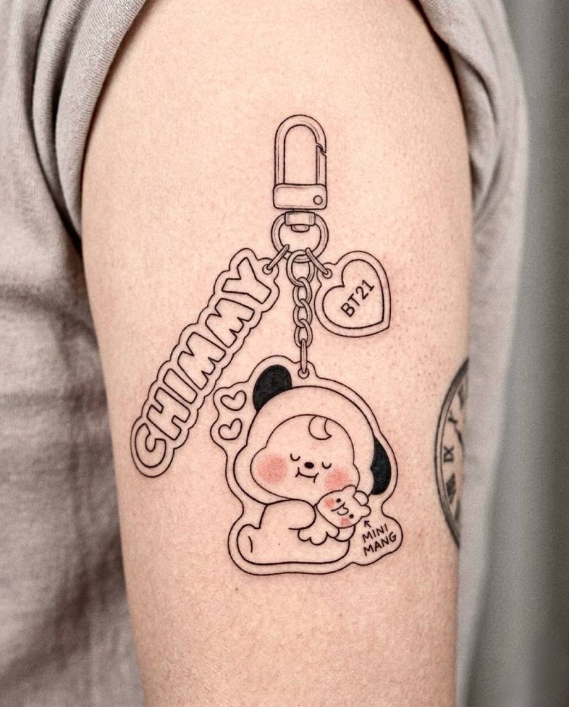 BT21 "Chimmy" keychain tattoo located on the upper arm.