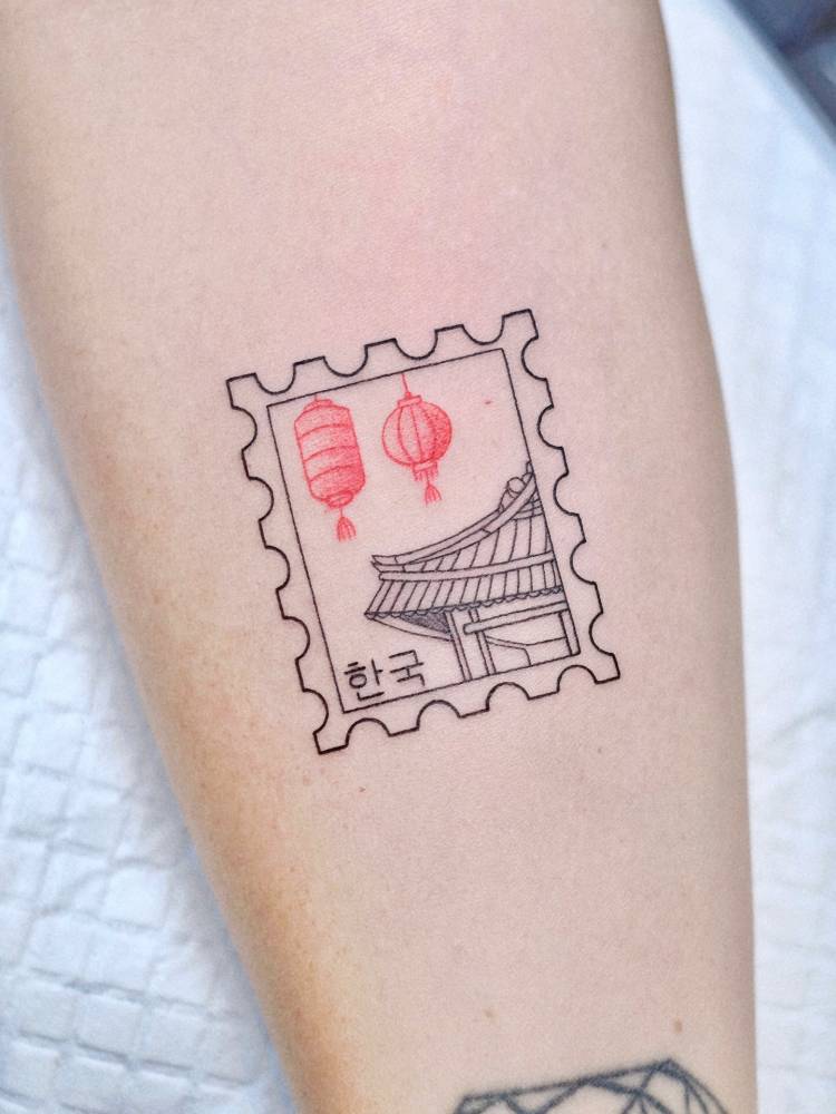 Fine line style Korean stamp tattoo located on the inner forearm.