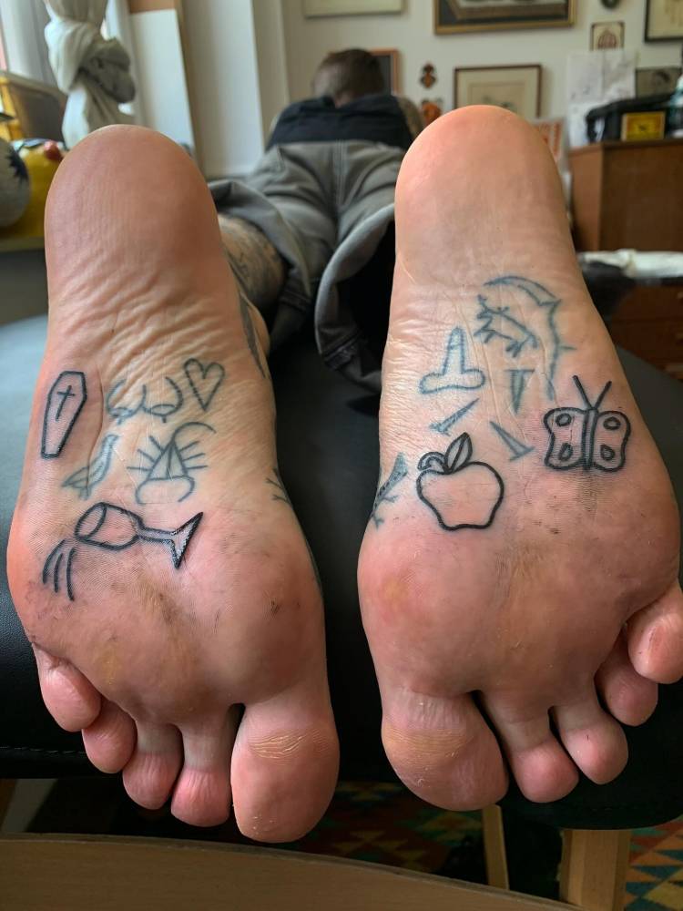 Minimalistic small tats done on the sole.