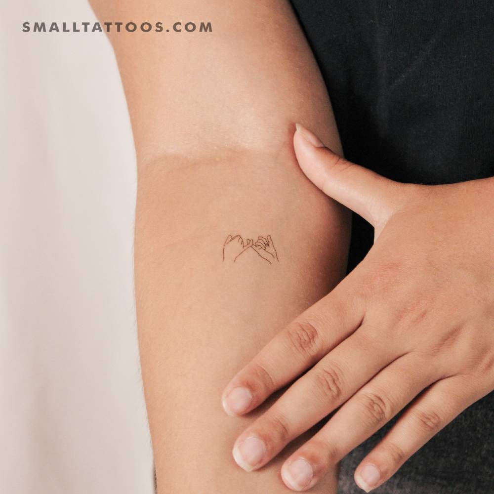 Small fine line style pinky swear temporary tattoo.